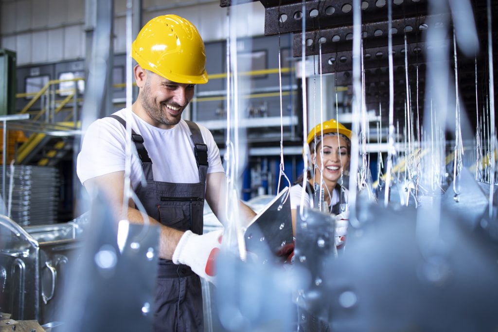 Male and female co-workers in a manufacturing setting
