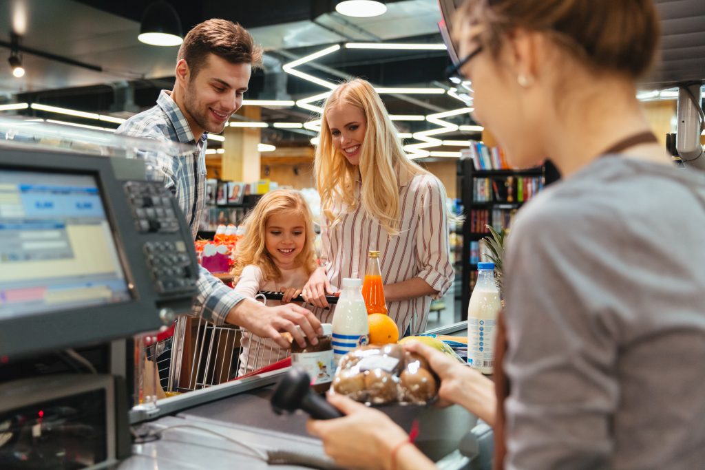 Family making a purchase at shop